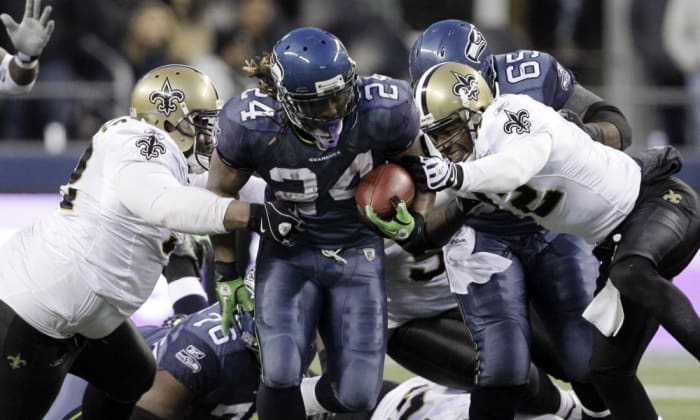 Seattle RB Marshawn Lynch breaks through the New Orleans defense for a game-clinching touchdown during a 2011 playoff game. Credit: USA TODAY